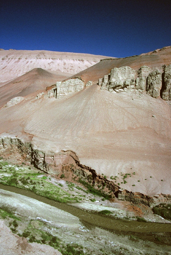 A stream of life and a desert mountain (Photograph from:  A Glimpse of Xinjiang)